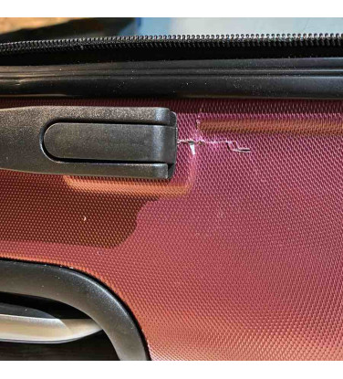 réparation de coque fendue de bagage